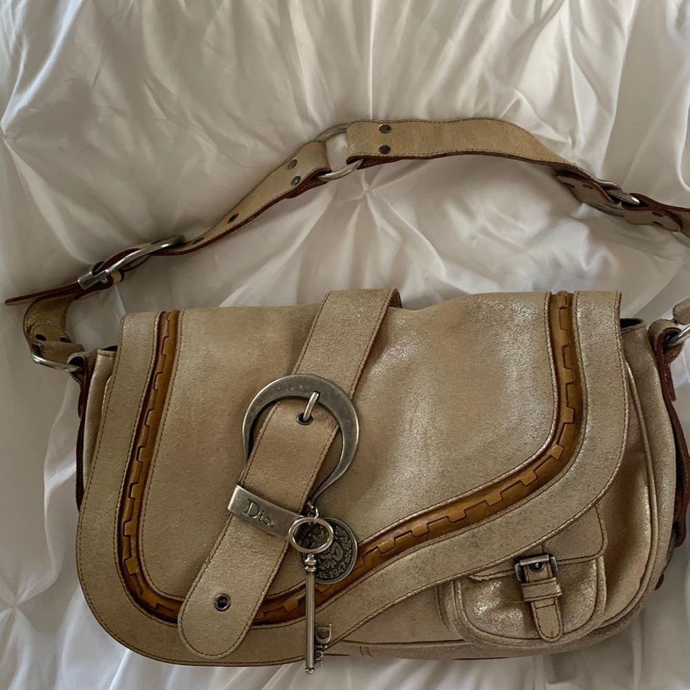 Authentic Christian Dior Saddle bag. Shimmery tan w  brown leather piping.